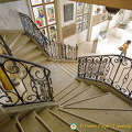 Ornamental staircase leading down from the 1st floor to the Sign Gallery.